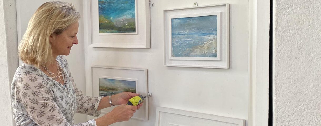Tracey Ross putting up an exhibition